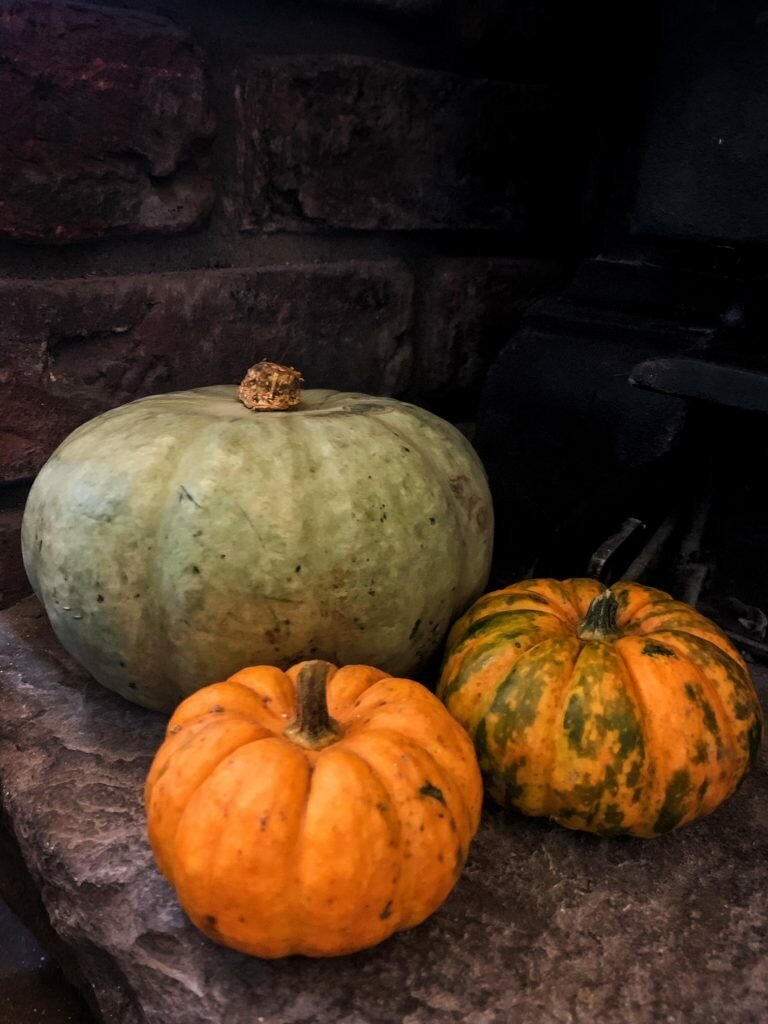 Three pumpkins by fire